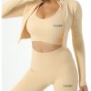 Gymgeek’s beige midi zip-up jacket, top, and leggings set, designed for comfort and style in one coordinated look.